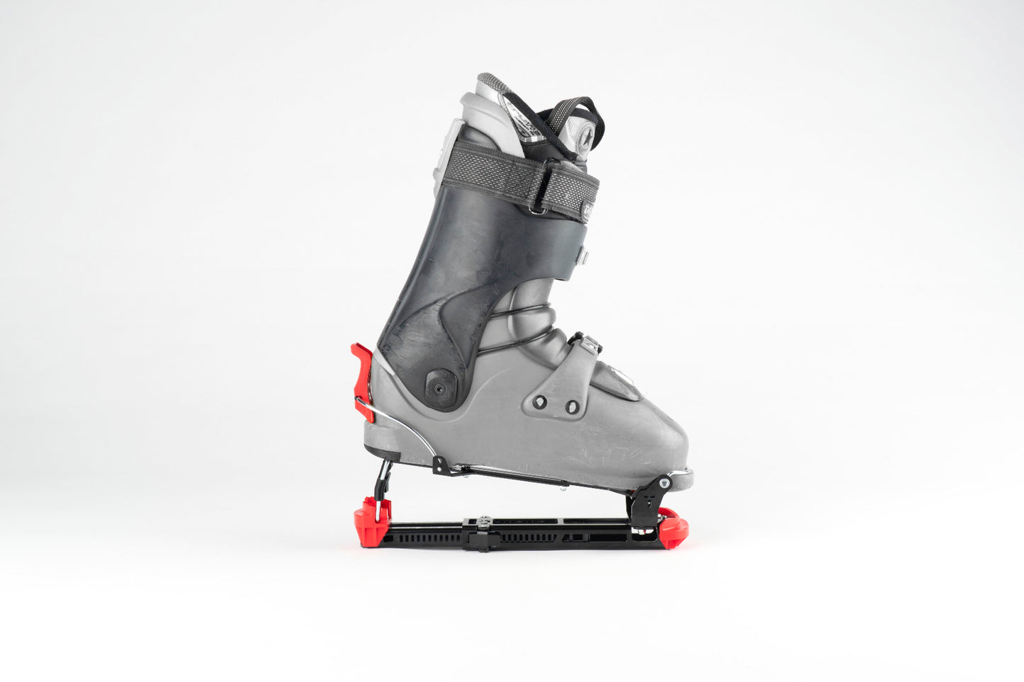 Tjava Randi ski touring adapter mounted on an alpine ski boot.